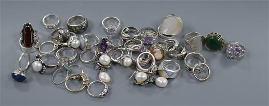 A quantity of assorted dress rings including 925 and a pair of earrings.